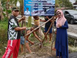 JALAN DI ASPAL-Warga Gang Damai Pasang Spanduk Ucapan Terima kasih untuk Pj Bupati 